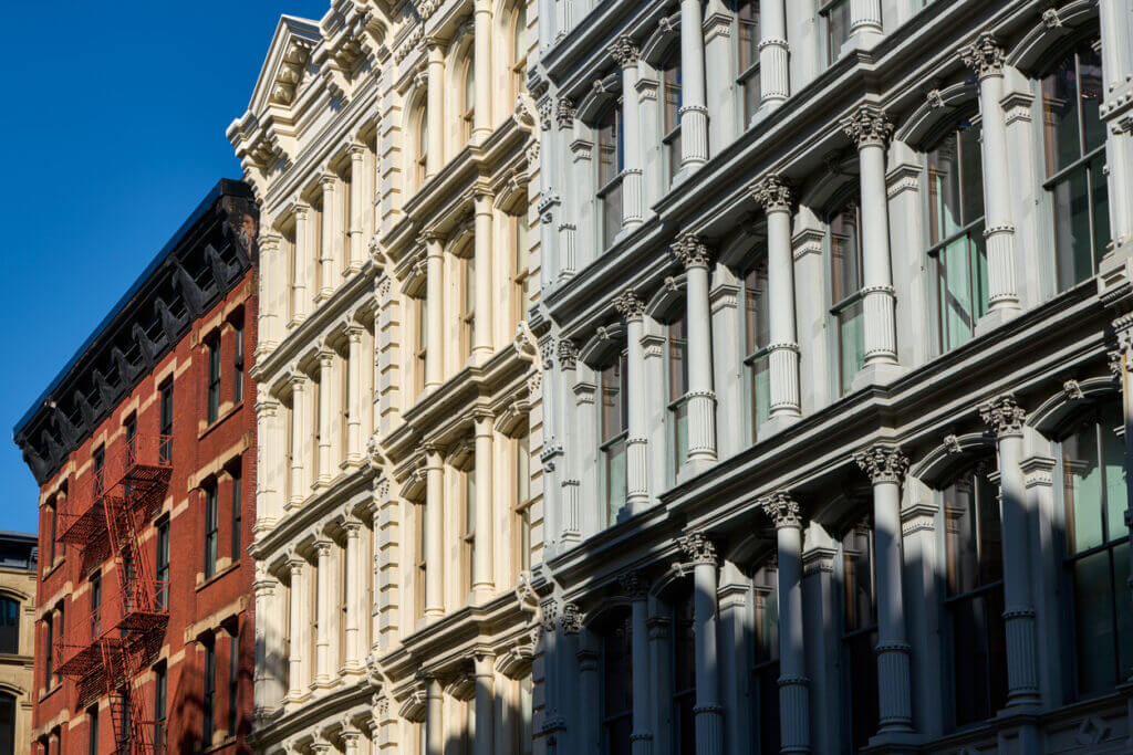 Exterior photo of Cast Iron style commercial buildings in SoHo, New York City. 
