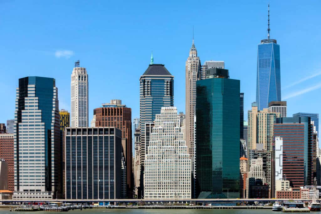 East River view of Downtown Manhattan's Financial District office buildings.