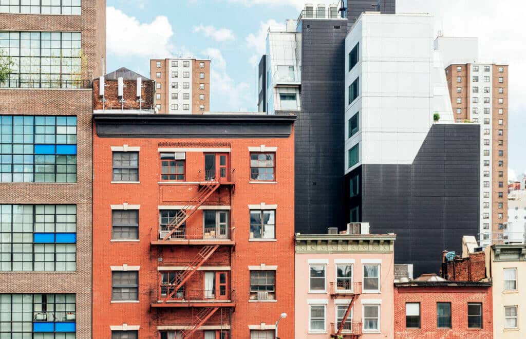 A row of buildings in Chelsea, Manhattan: residential above and commercial retail below.