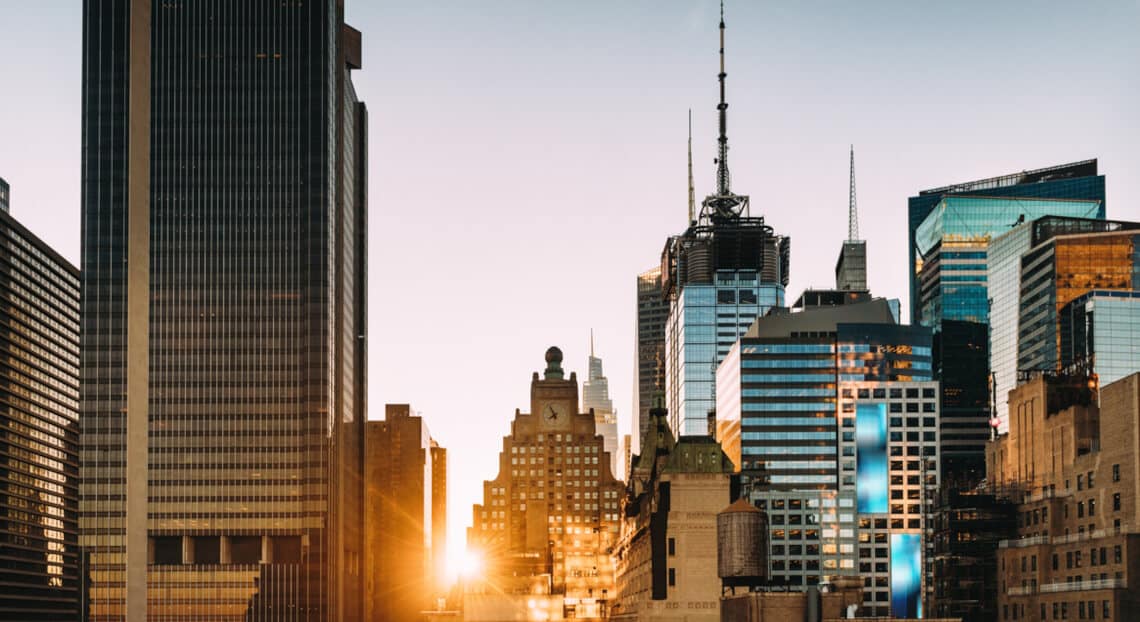 Times Square sunrise, emblematic of NYC's vibrant commercial real estate energy.