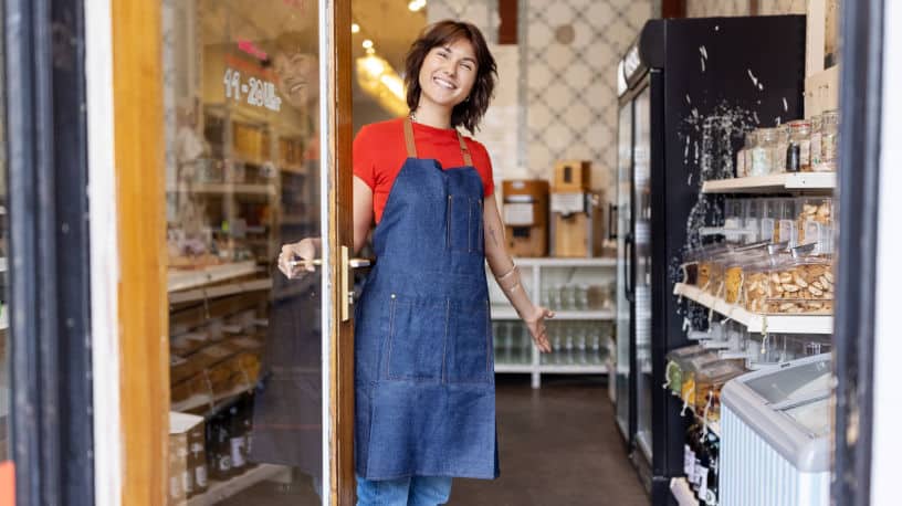 Business owner welcomes customer to zero-waste store; retail space available in Manhattan, NYC