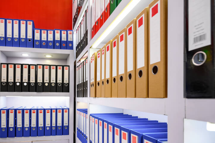 Well-organized file room with neatly arranged binders.