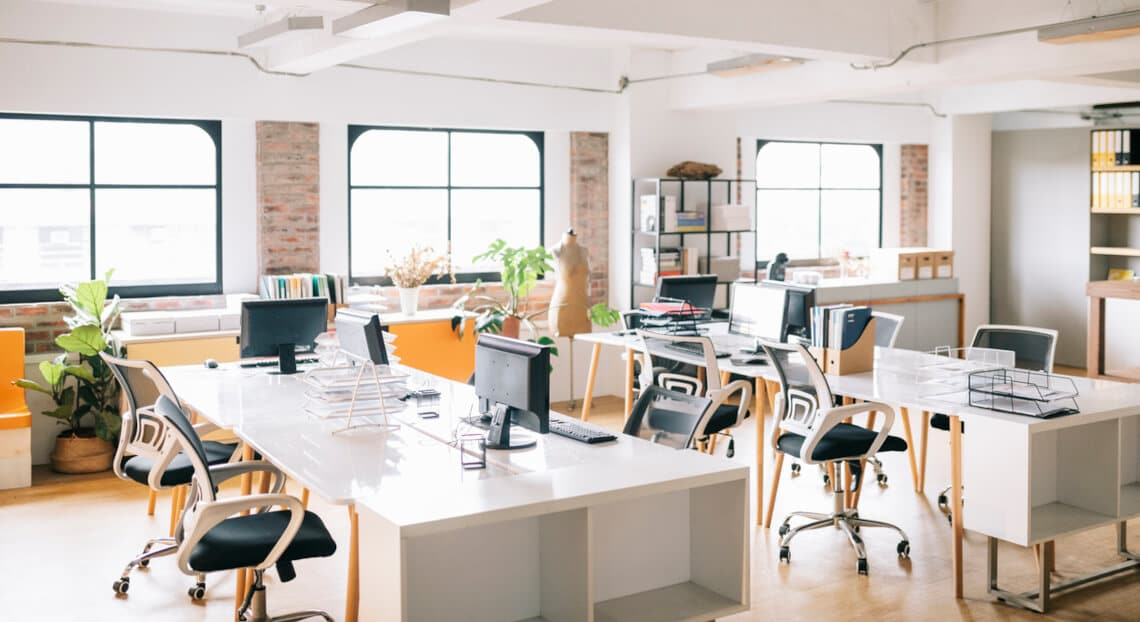 Empty workspace symbolizing the shift to adaptability and privacy in 2024 corporate environments.