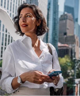 Businesswoman walking in New York Downtown Tribeca.