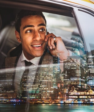 Businessman in a yellow cab in Midtown Manhattan