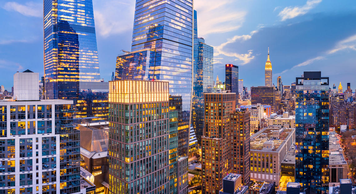 NYC skyscrapers at dusk near Hudson Yards, capturing the 2024 commercial real estate revival.