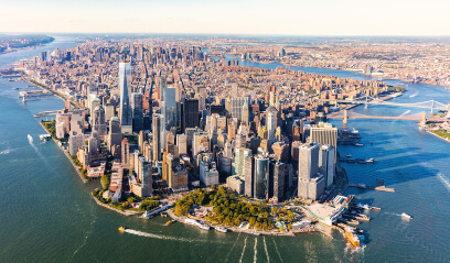 Aerial view of Manhattan, symbolizing post-pandemic resurgence in $100-plus office leases.