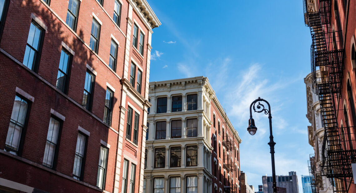 Vintage-inspired SoHo storefront with bright blue sky, symbolizing Baltic Watches' expansion.