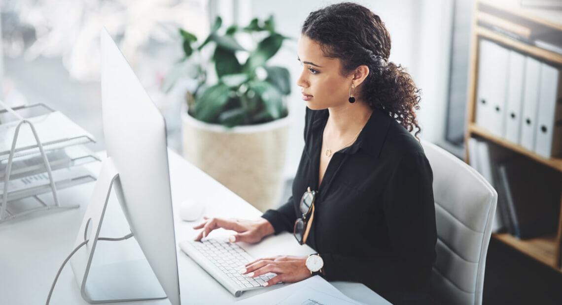 Young Businesswoman in NYC Office with High-End Furniture