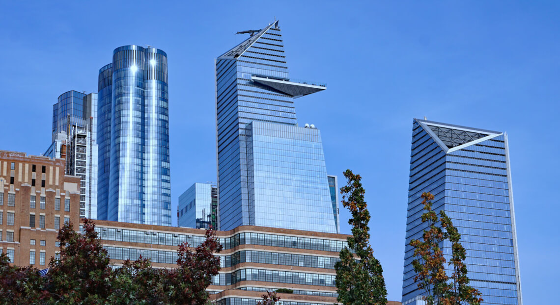 Manhattan skyline with 30 Hudson Yards, emblematic of NYC's commercial real estate prowess.