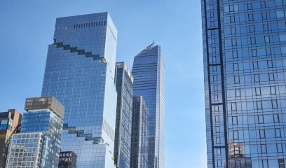 NYC skyline with the Spiral; epitome of modern commercial real estate battleground.