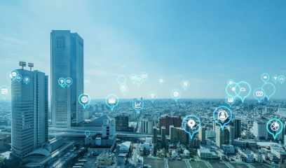 Cityscape with tall buildings and digital icons showing smart city tech.