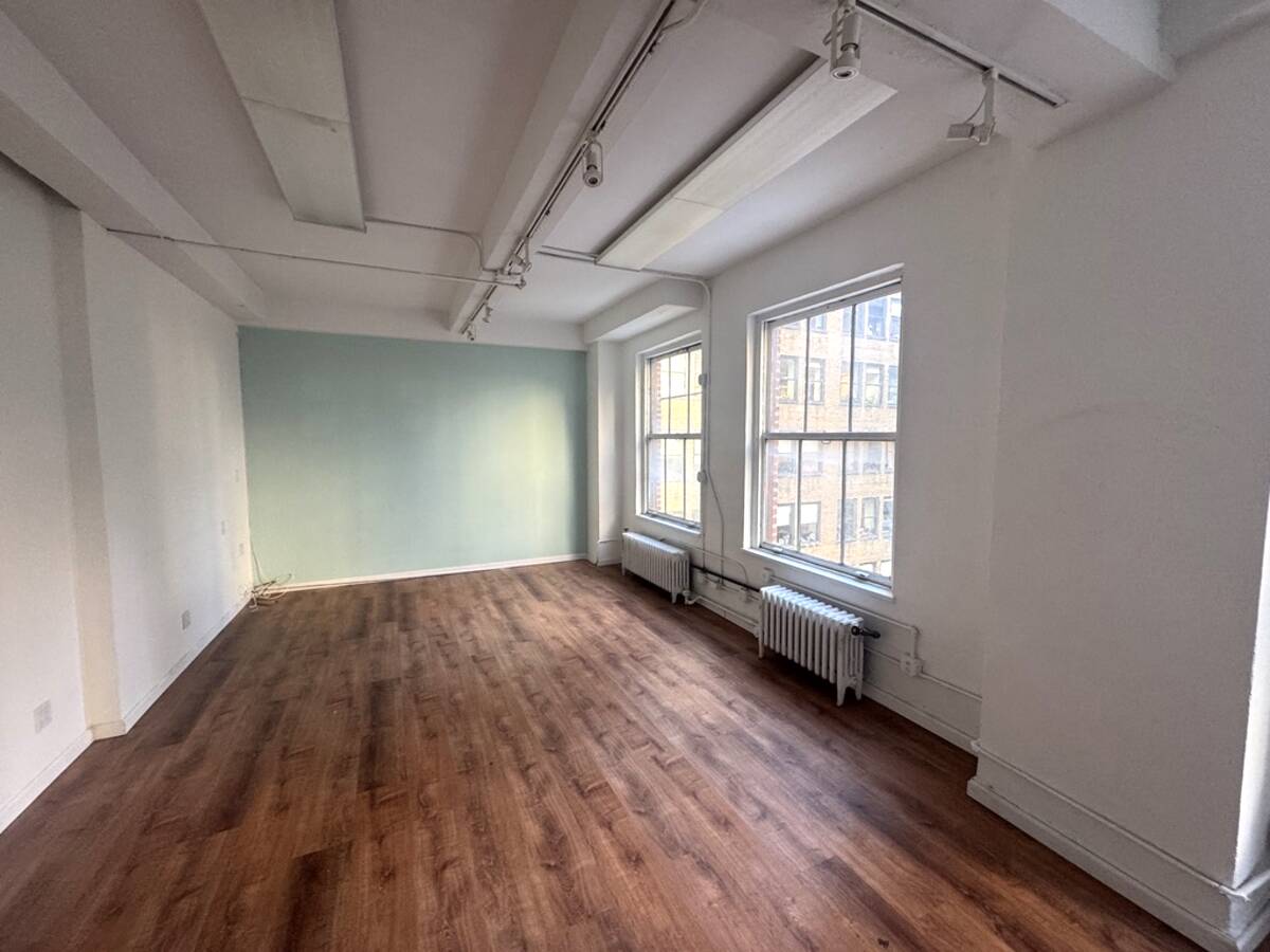 Private office with exposed beam ceilings