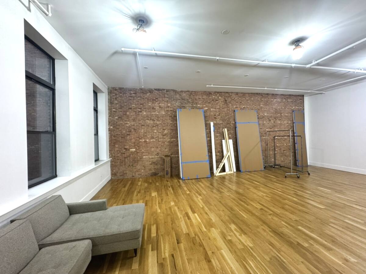 Exposed brick wall natural light