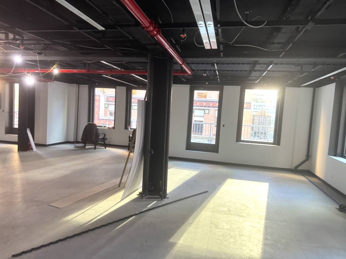 Open floor plan with column and windows