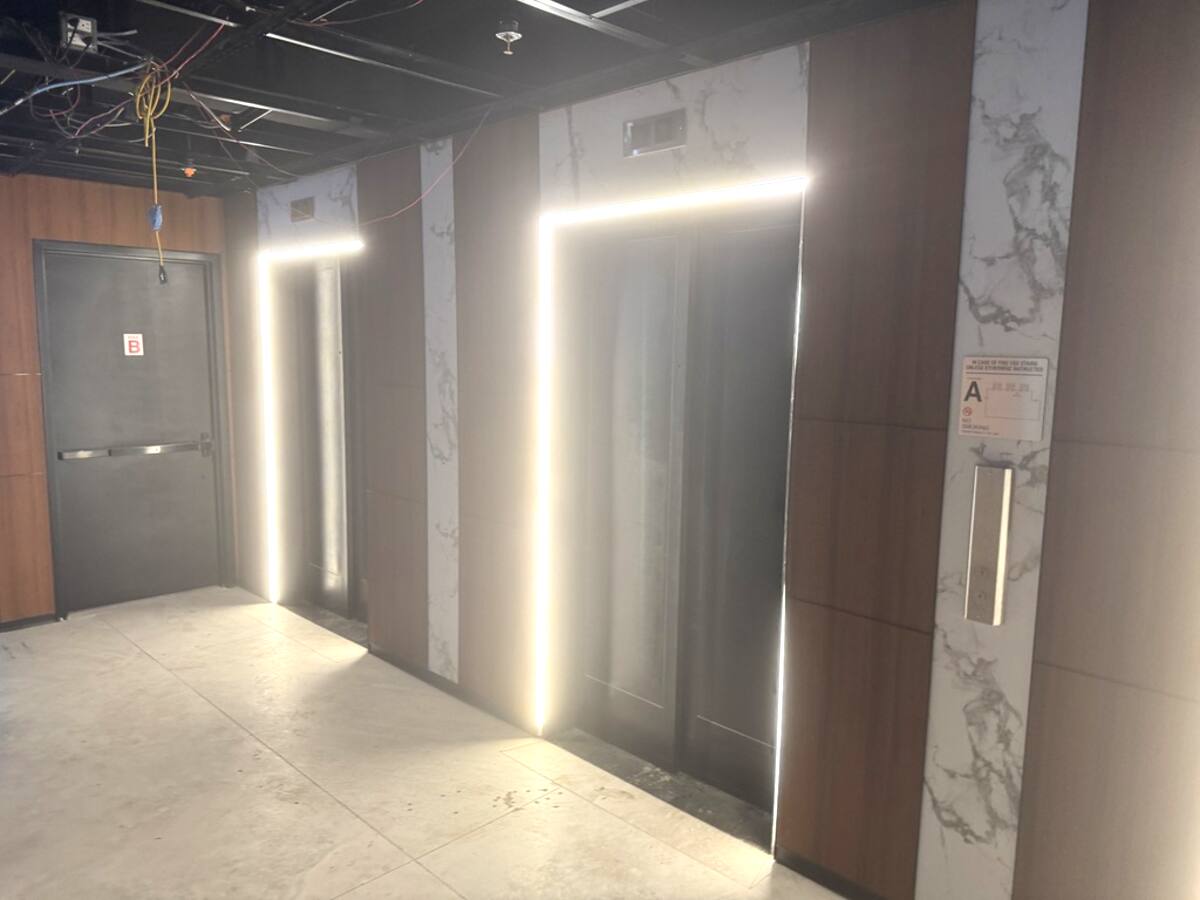 Renovated elevator lobby with modern finishes