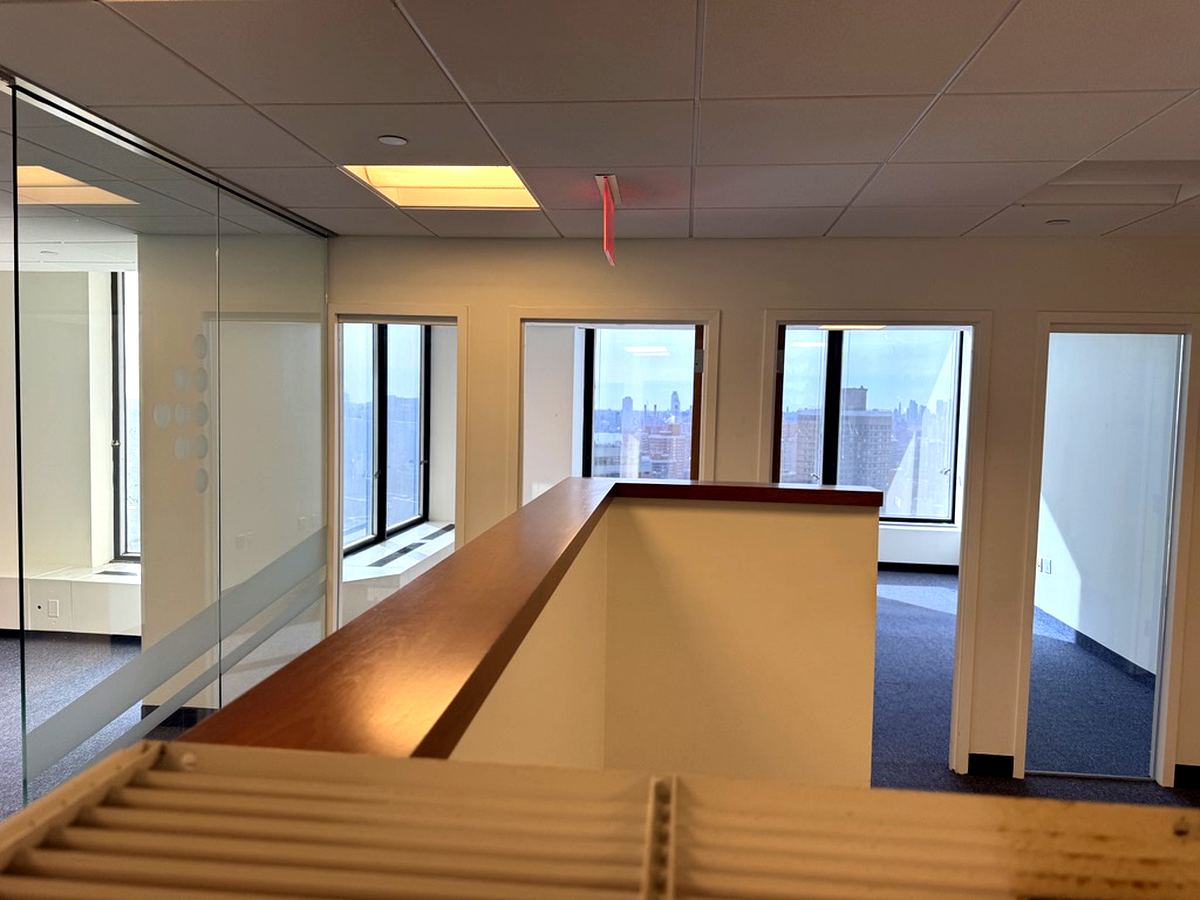 Glass partition offices with windowed perimeter rooms, 25th floor at 3 Park Avenue