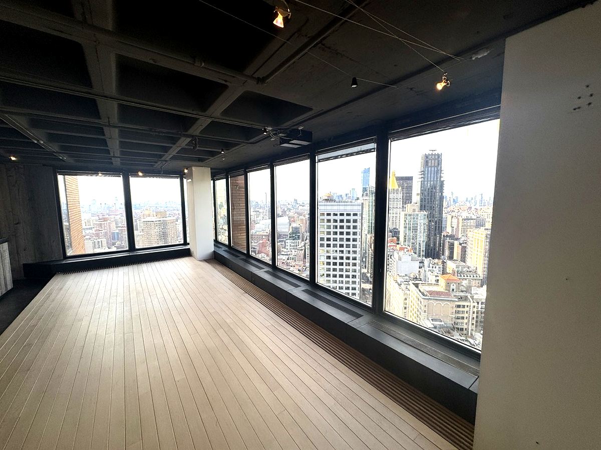 Wrap-around windows and open loft space on the 32nd floor at 3 Park Avenue
