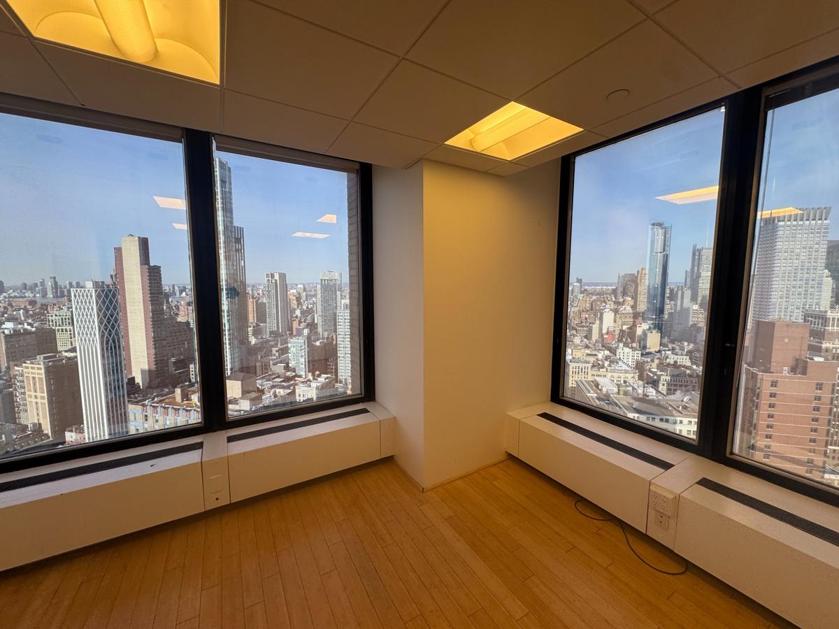 Windowed conference room with whiteboard and bamboo hardwood floors at 3 Park Avenue 37th floor