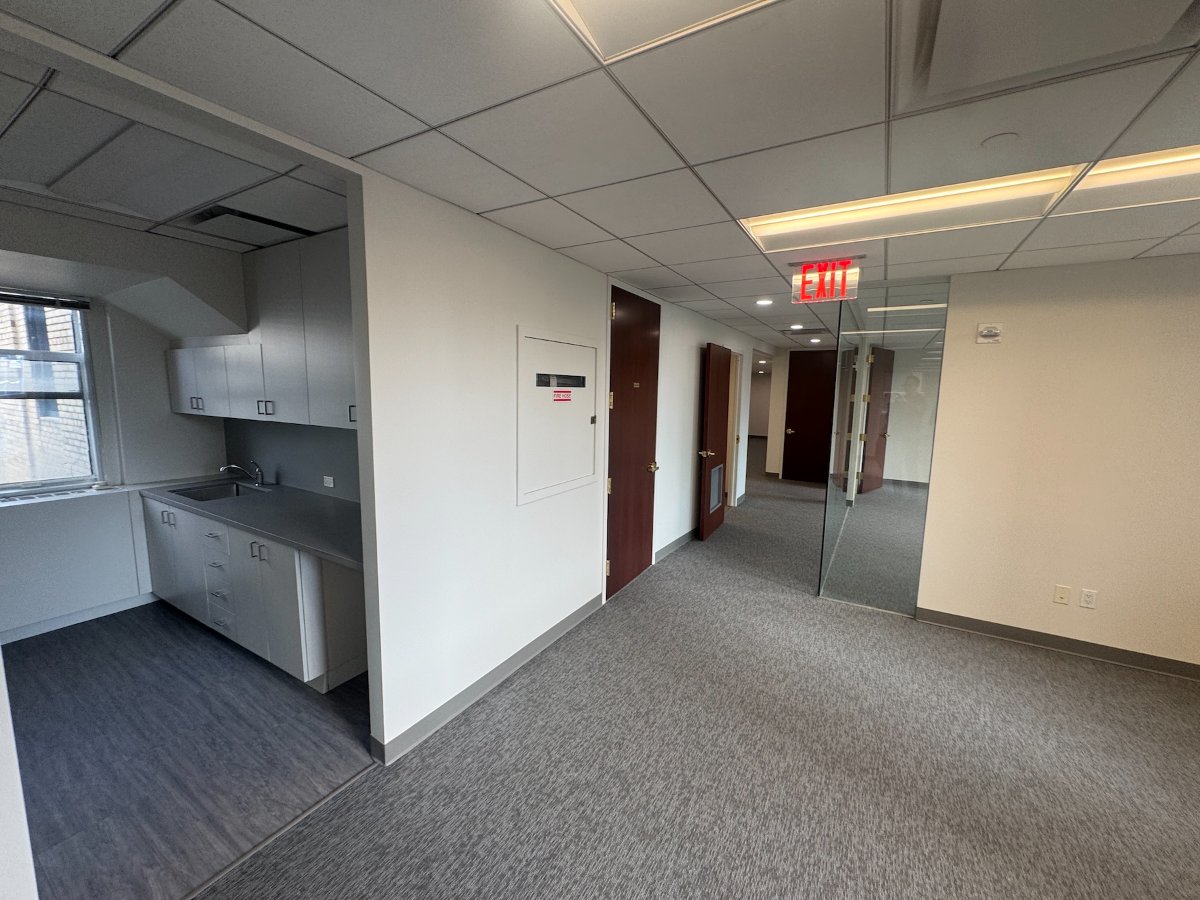 Open plan office area with drop ceiling lighting at 122 East 42nd Street floor 29