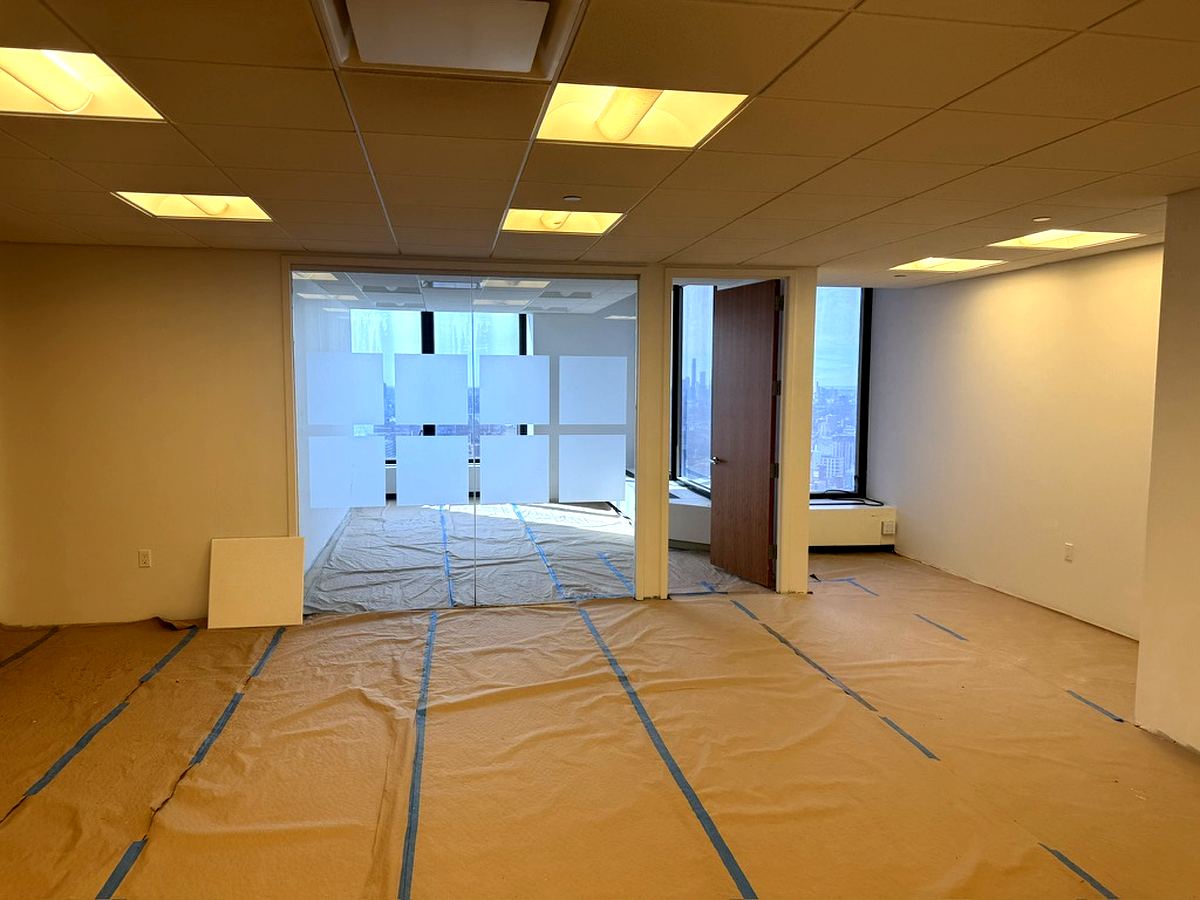 Open plan office space with glass partition wall, partial 37th floor at 3 Park Avenue