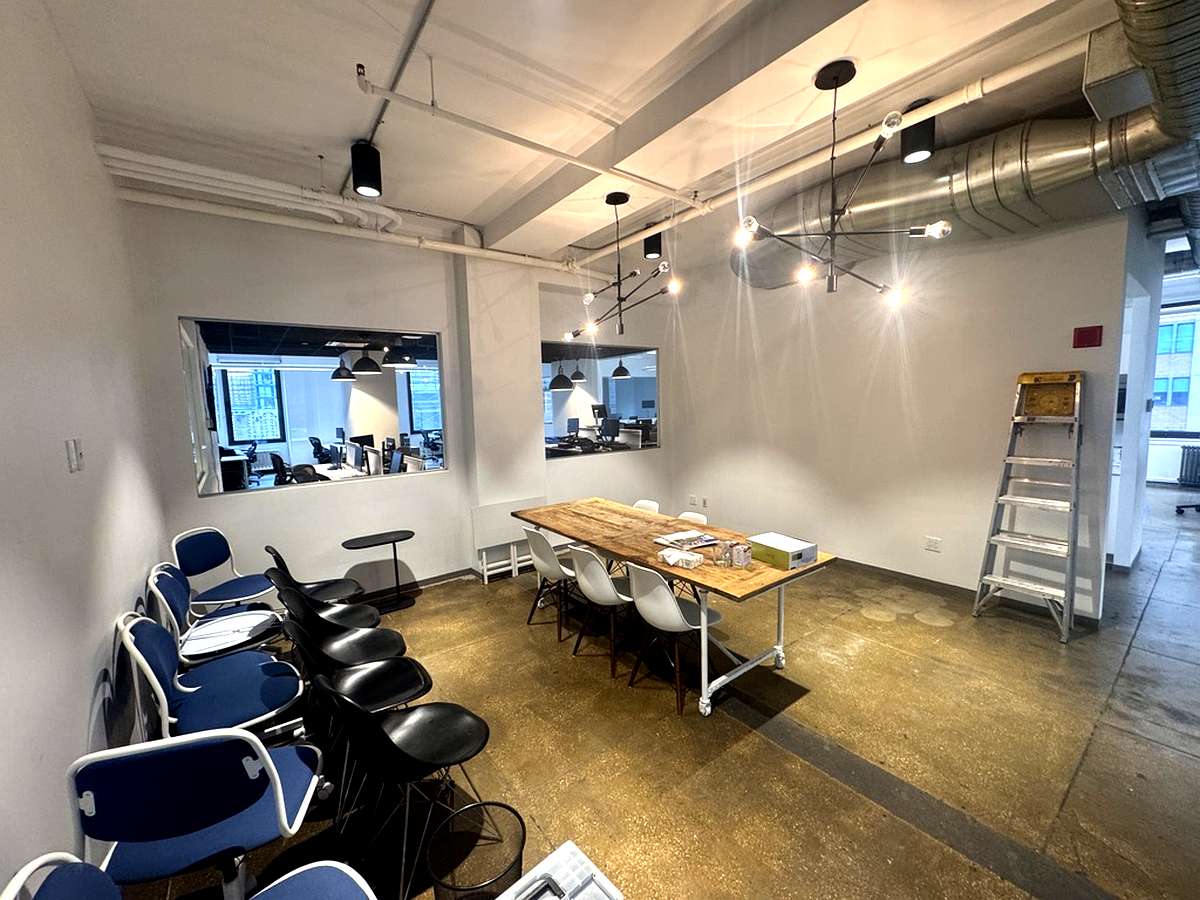 Conference room with sputnik pendant lighting and interior windows, 16th floor at 15 Maiden Lane