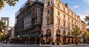 Bossert Hotel corner with scaffolding and sign, entrance seen at right.