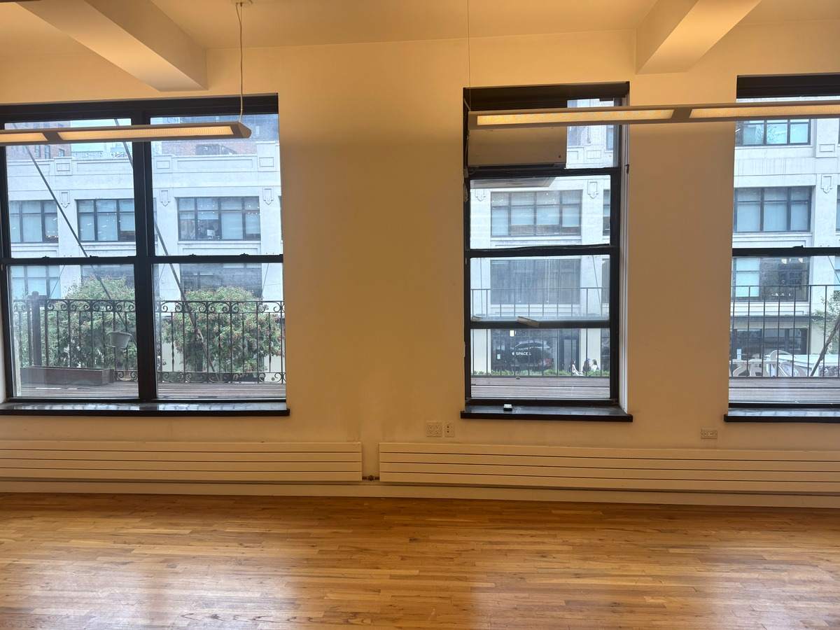 Row of tall windows over hardwood floors, Suite 2N at 420 West 14th Street