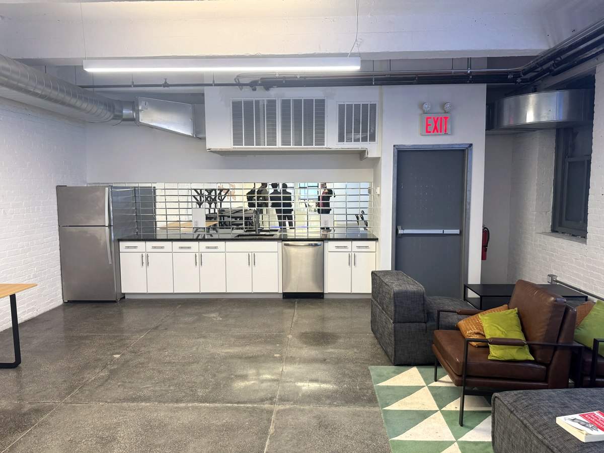 New wet pantry beside lounge with soft seating, 2nd floor at 426 West 14th Street