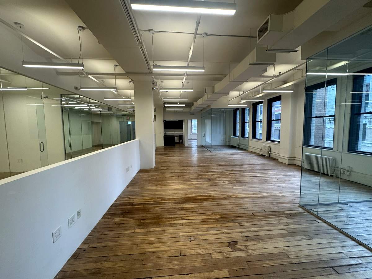 Long open floor with glass offices, partial 9th floor at 31-37 West 27th Street