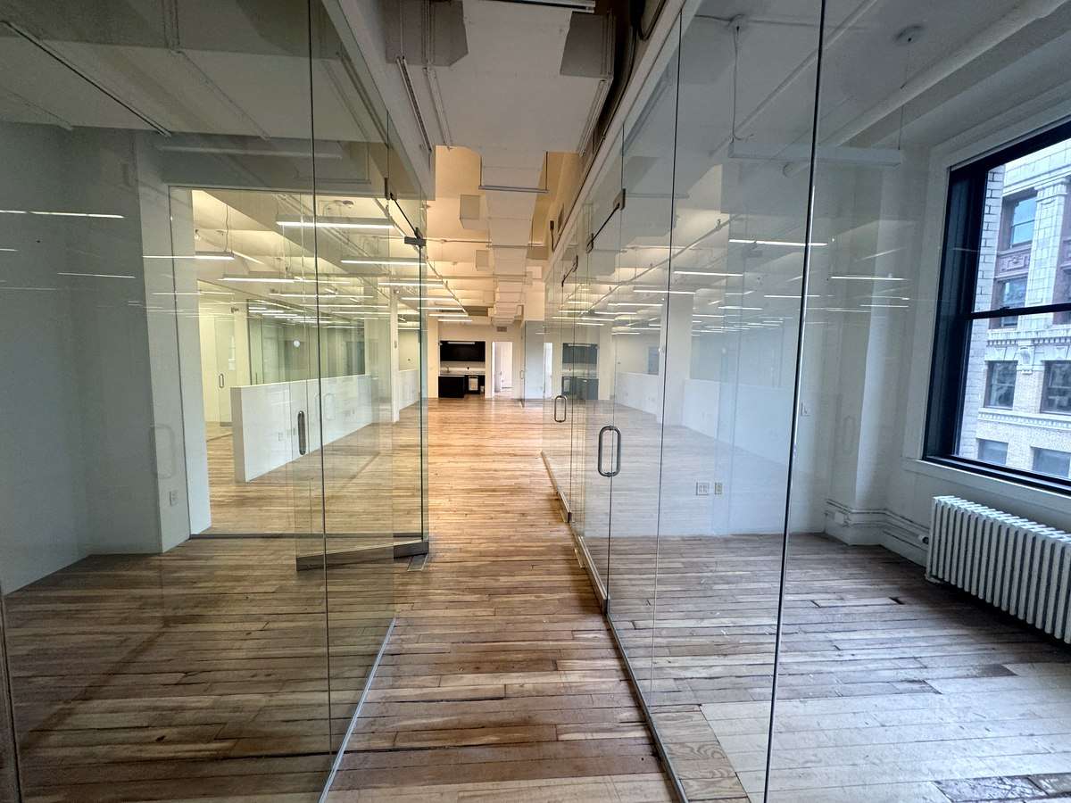 Glass office facing the open floor, partial 9th floor at 31-37 West 27th Street