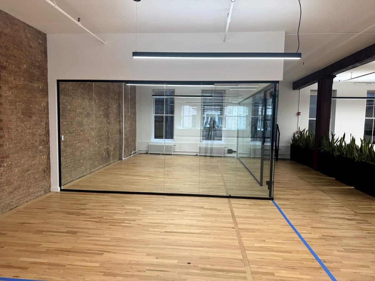Glass conference room facing the windows, partial 3rd floor at 131-133 Spring Street
