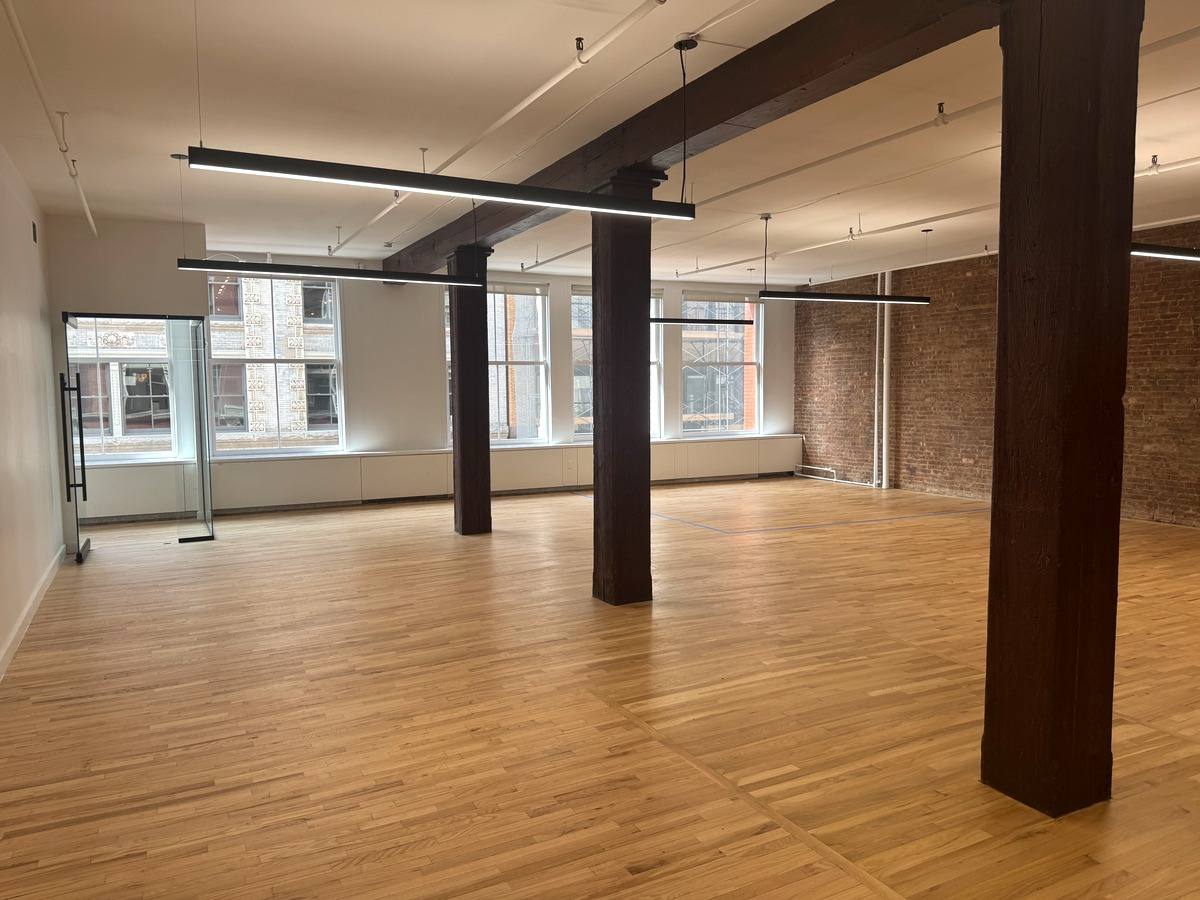 Bright bullpen with oversized windows, partial 3rd floor at 131-133 Spring Street