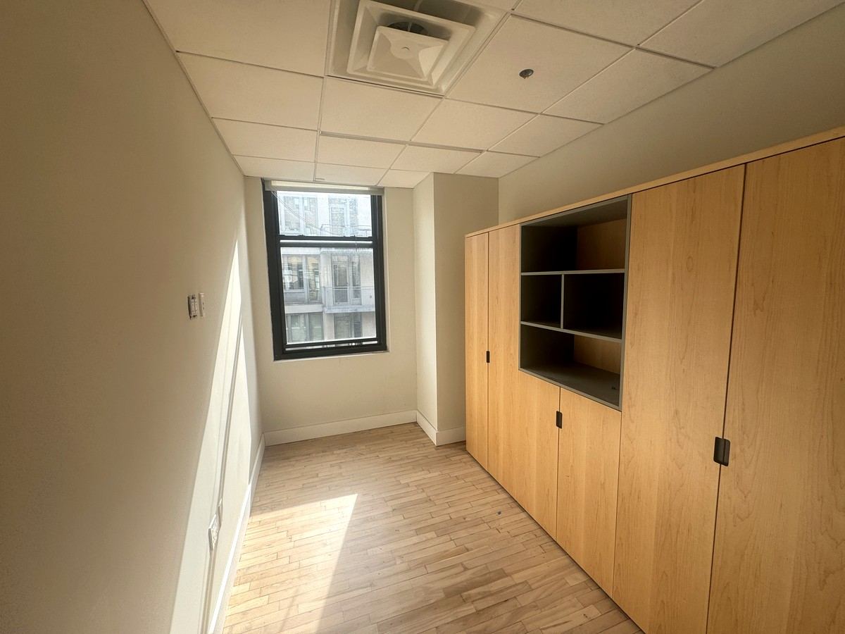 Private office with built-in wood cabinetry, 10th floor at 118 West 22nd Street