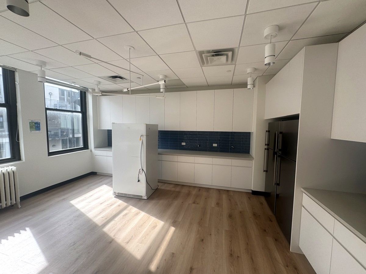 Modern pantry with white cabinetry, 10th floor at 118 West 22nd Street