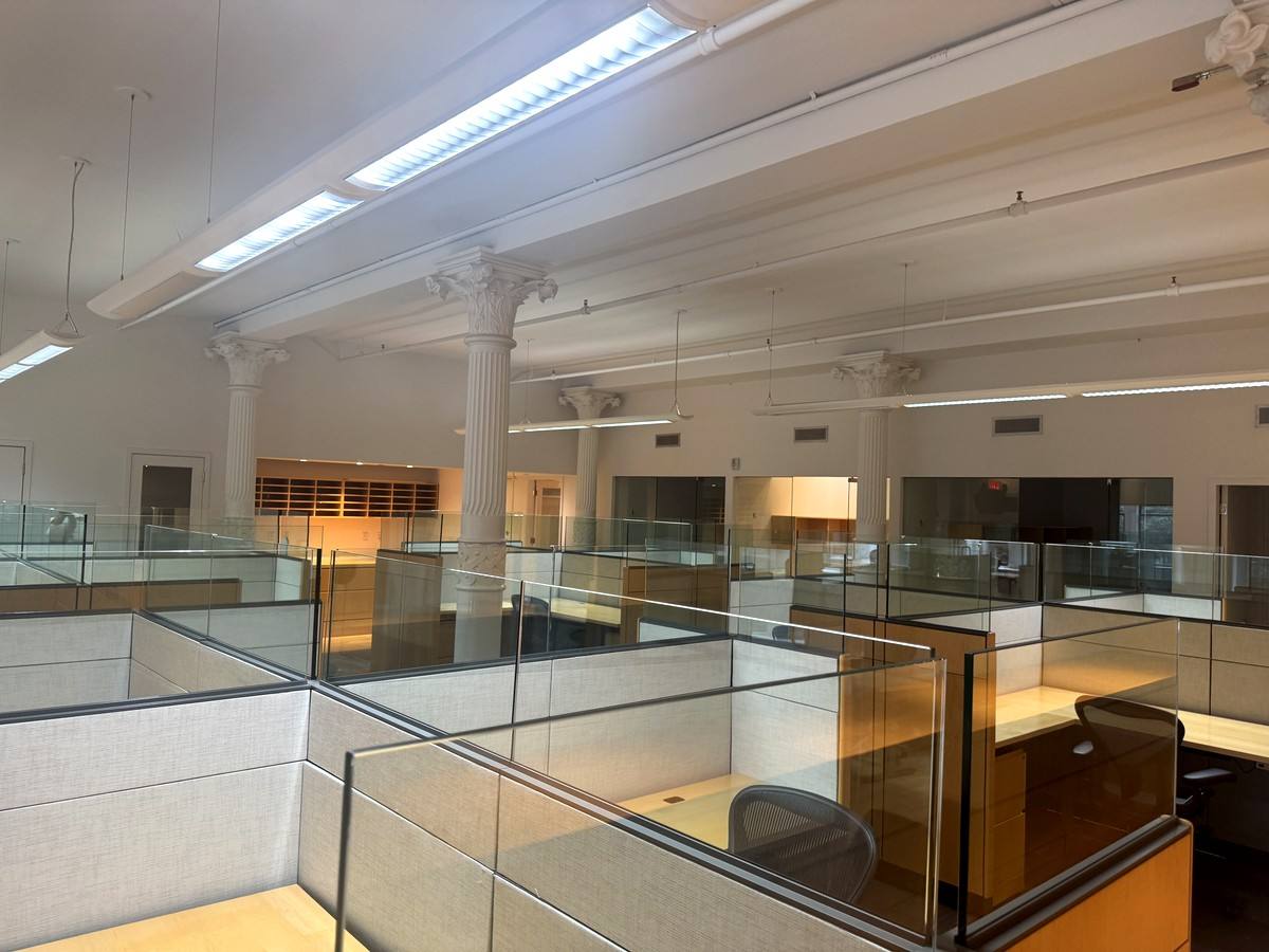 Glass-paneled workstation pods in open bullpen, 2nd floor at 380 Lafayette Street