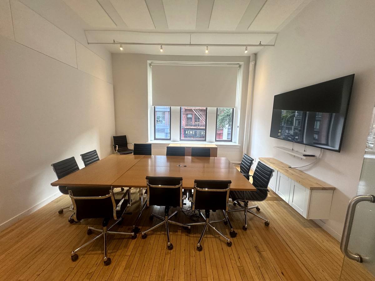 Conference room with large table and wall screen, 2nd floor at 380 Lafayette Street