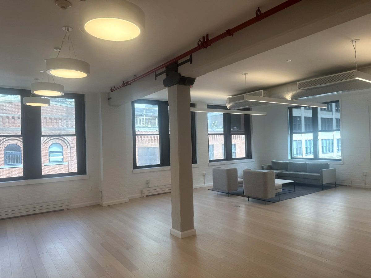 Open floor with lounge seating and tall windows, 5th floor at 530 West 25th Street
