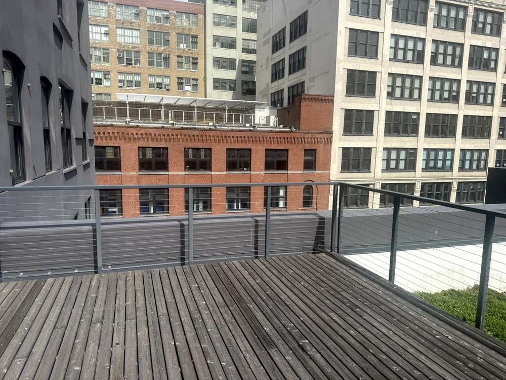 Terrace deck with planter beside neighboring loft buildings, 5th floor at 530 West 25th Street