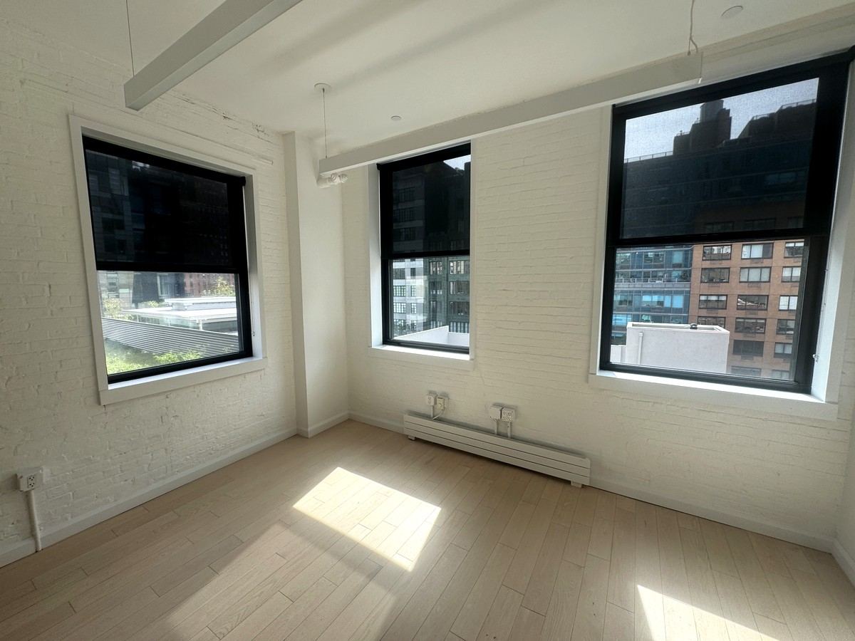 Sunlit private office with whitewashed brick, 5th floor at 530 West 25th Street