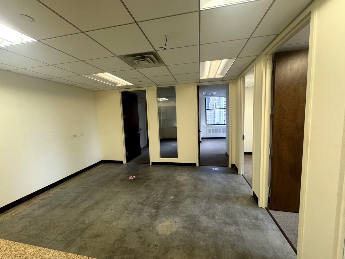 Open work area leading to private offices, Suite 1502A at 80 Maiden Lane