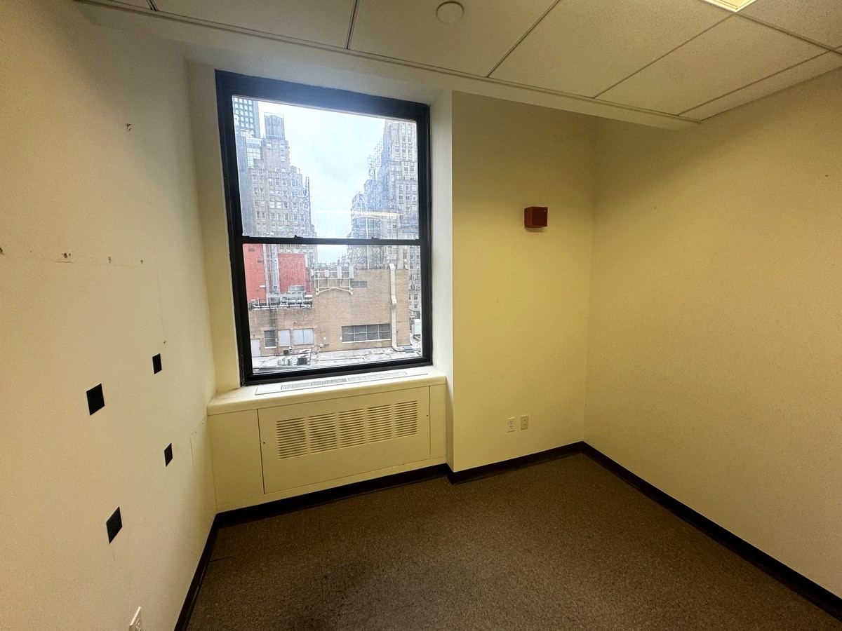 Private office with a tall window, Suite 1502A at 80 Maiden Lane