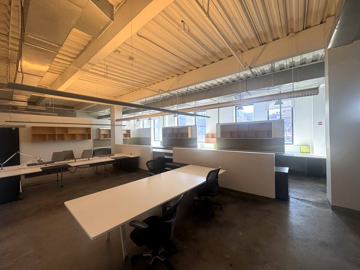 Sunlit desks under an exposed ceiling, 4th floor at 415 West 13th Street