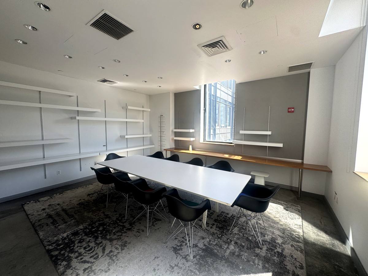 Conference room with long table and wall shelving, 4th floor at 415 West 13th Street