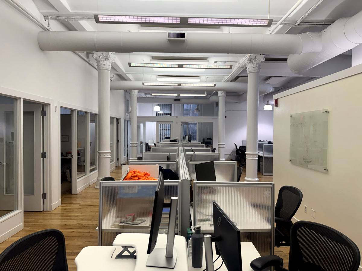 Bullpen with glass-front offices along one wall, 5th floor at 3 West 18th Street
