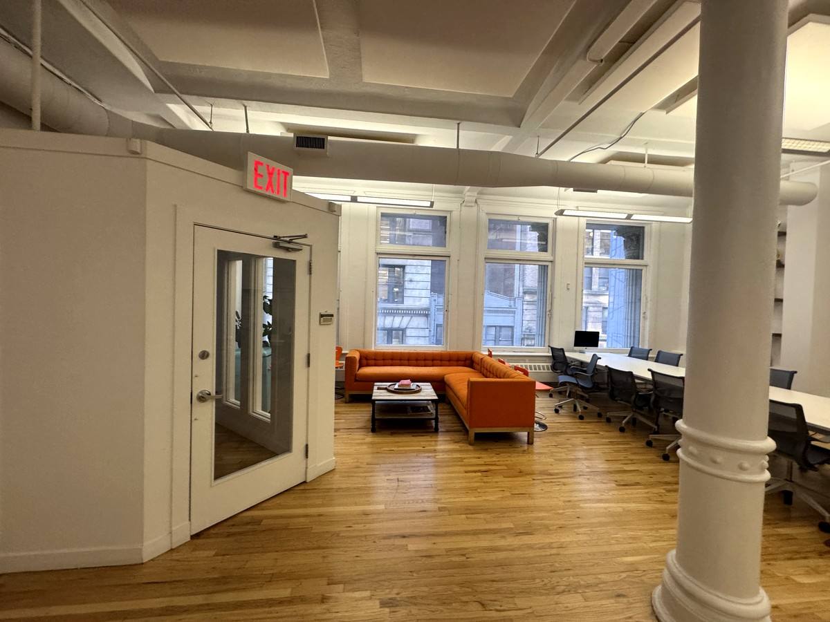 Lounge seating by tall windows and hardwood floors, 5th floor at 3 West 18th Street