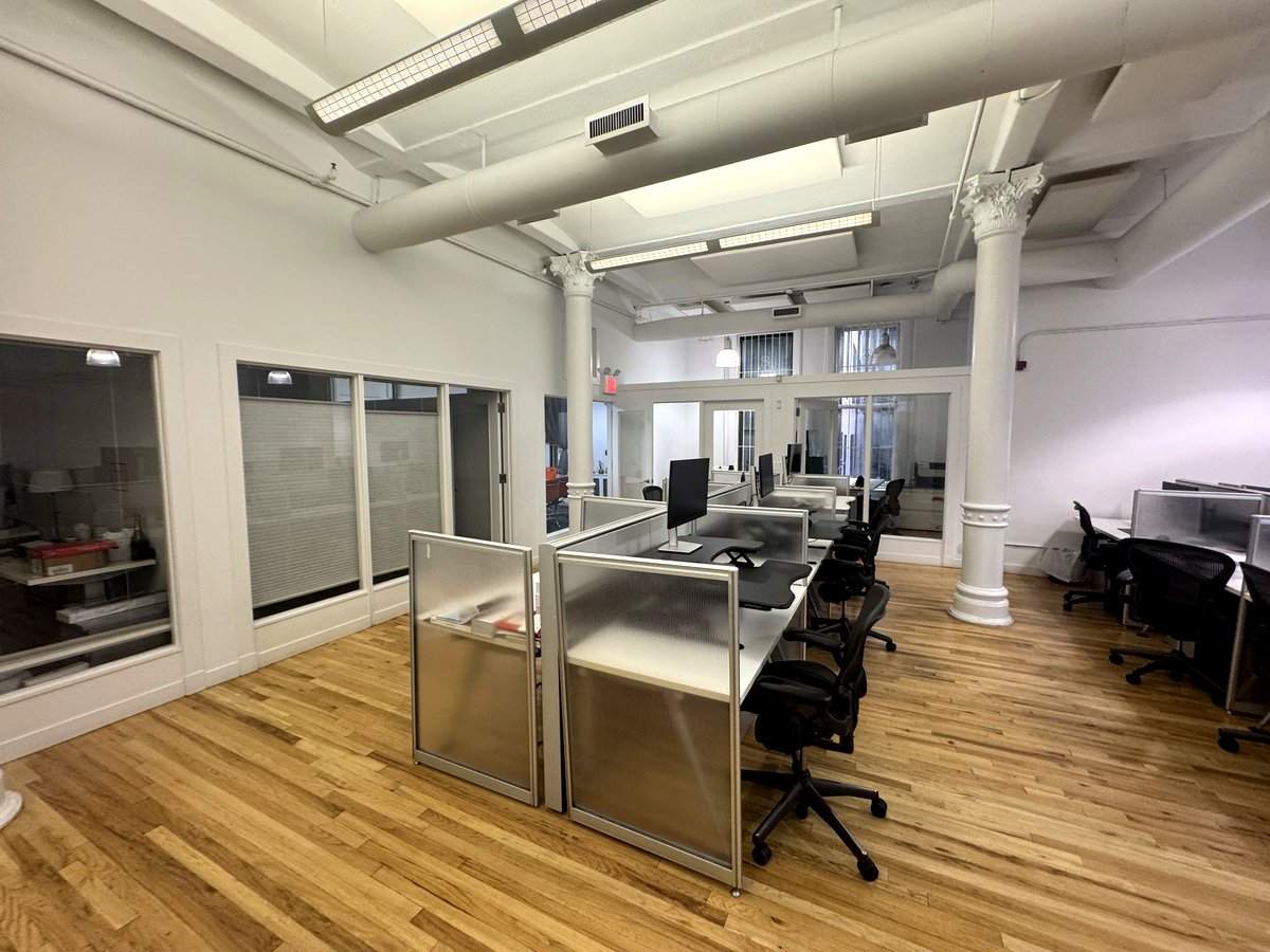 Glass-front offices beside open workstations, 5th floor at 3 West 18th Street