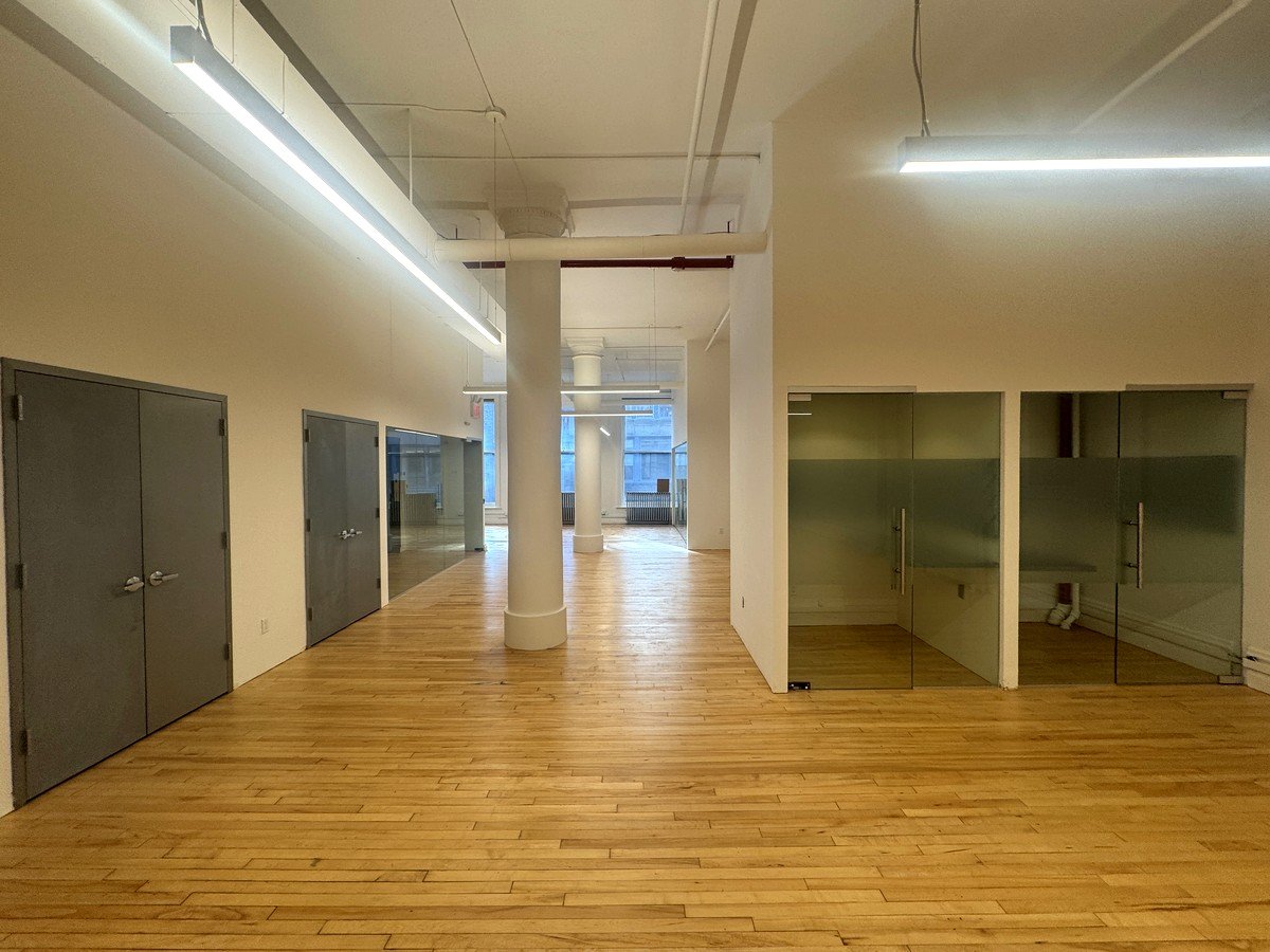 Open loft with decorative column and frosted glass offices, 2nd floor at 36-38 East 20th Street