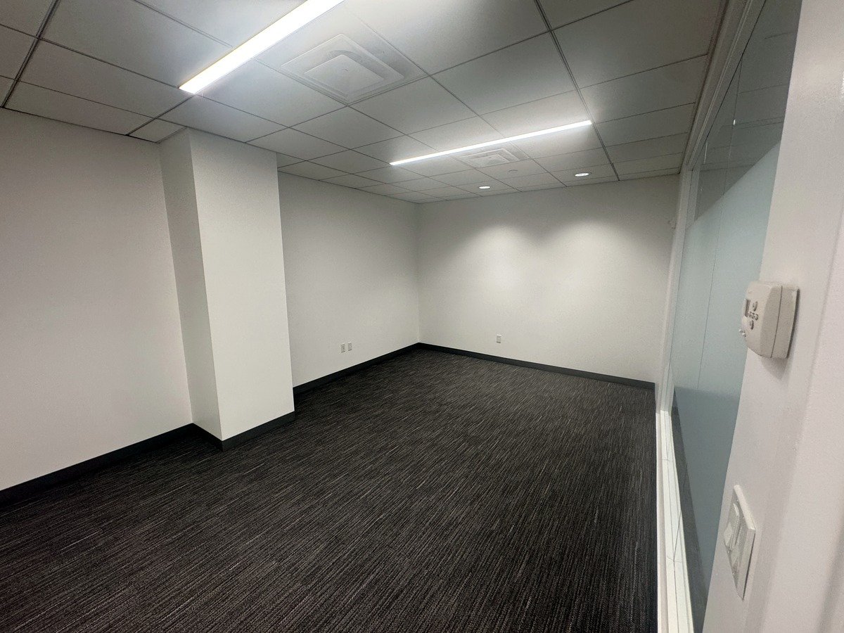 Large meeting room with glass wall and carpet, 12th floor at 20 West 55th Street